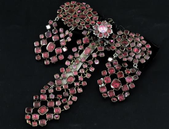 A late 18th century French pinchbeck and shaped cut garnet set drop hair ornament, 10cm.